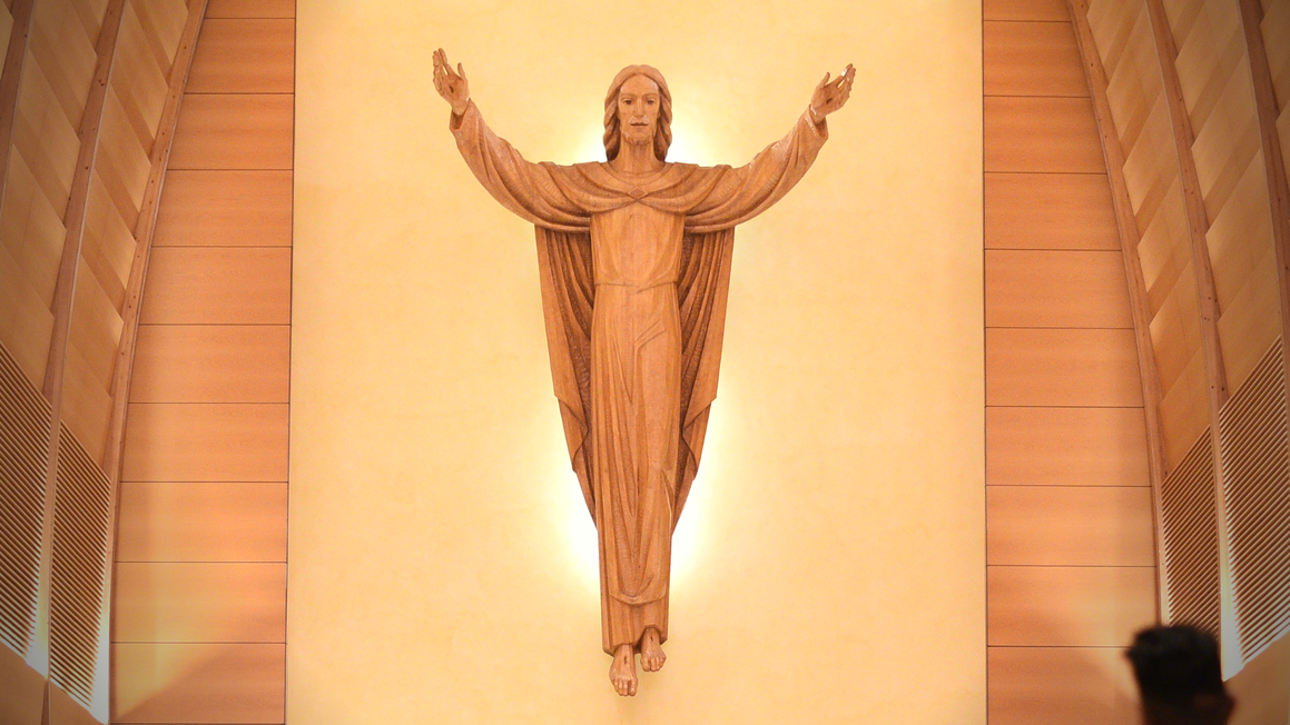 Quiet chapel light with an open Bible and candles